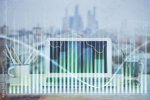 Stock market graph and table with computer background. Double exposure. Concept of financial analysis.