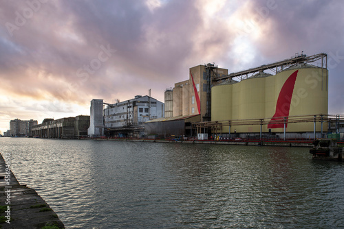 Cereal grain storage silo on the quay of a port in Saint-Nazaire, France, for transport by ship © sissoupitch