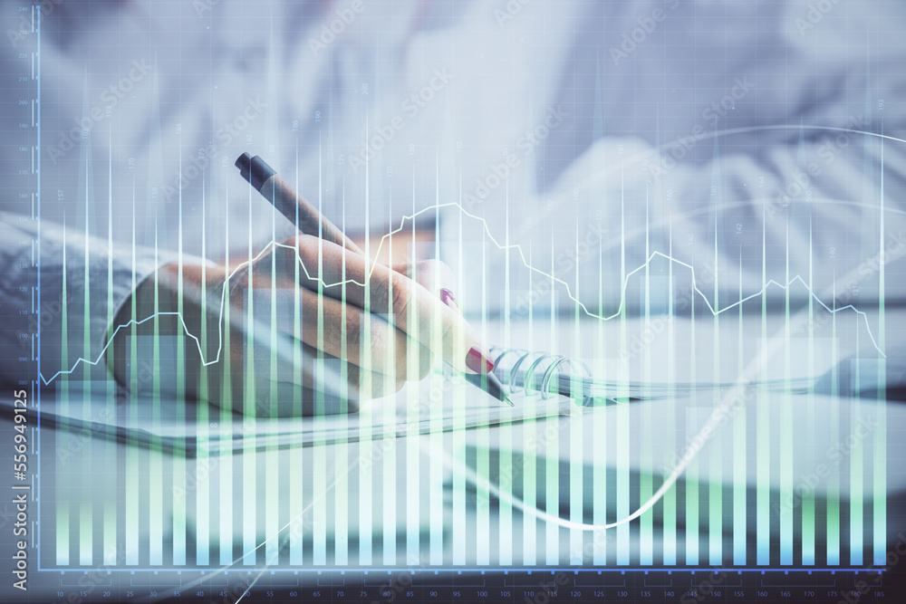 Double exposure of woman's hands making notes with forex graph hologram. Concept stock market analysis. Double exposure of woman's hands making notes with forex graph hologram. Concept stock market analysis.