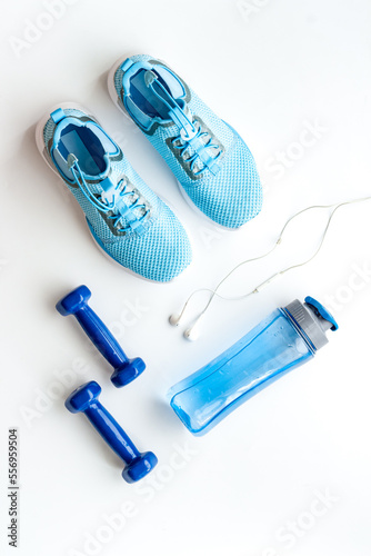 Gym and fitness equipment and workout tools with sneakers and dumbbells