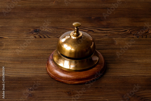 Close up of hotel golden service bell. Attention concept