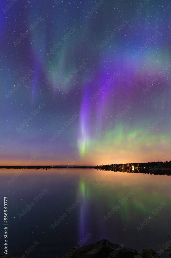 Northern lights reflected in the sea. Nykarleby/Uusikaarlepyy. Finland