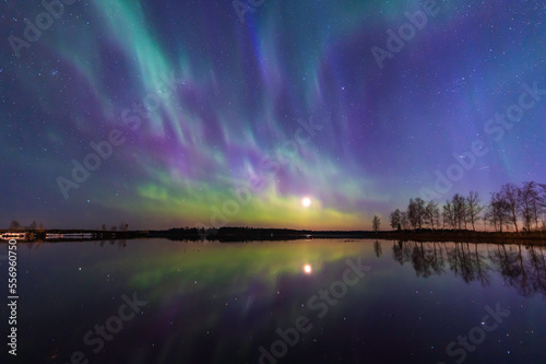 Northern lights reflected in the sea. Nykarleby/Uusikaarlepyy. Finland