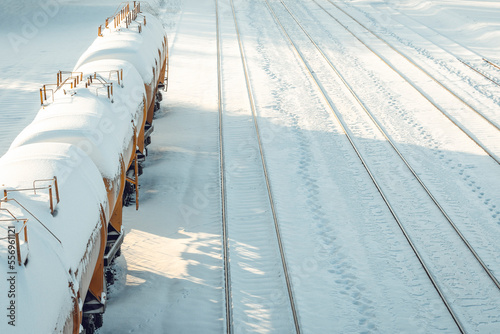 Snow covered tank-wagons with crude oil