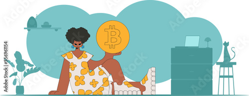 The girl is holding a bitcoin coin. Cryptocurrency and fiat exchange concept.
