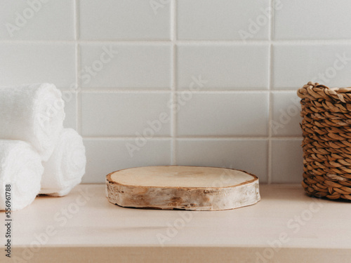 Natural round podium for bathing products in bathroom