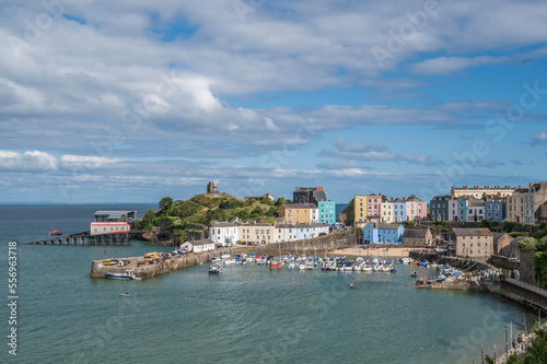 Tenby harbour. A coastal resort in Pembrokeshire, south Wales. Colourful buildings overlook the harbour, on a sunny, summers day.