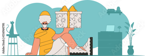 The guy holds a box with gifts in his hands. Holiday gift.