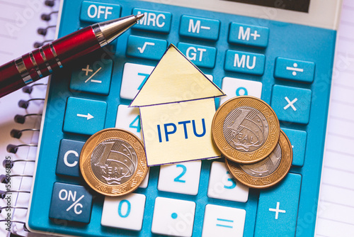 As iniciais IPTU referente a Imposto Predial e Territorial Urbano. Economia brasileira e finanças. photo