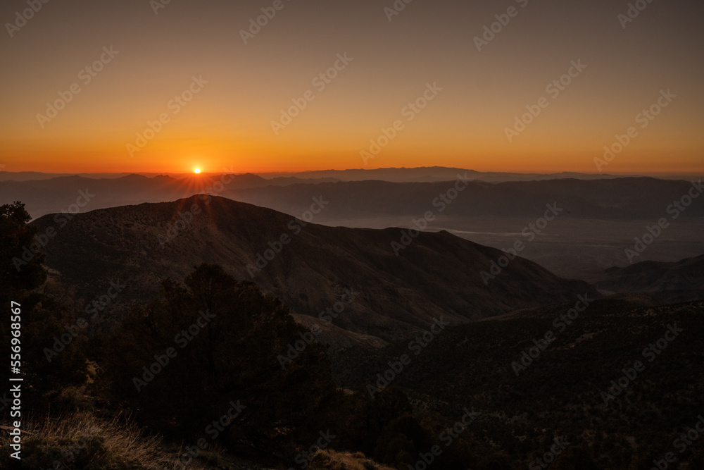 Orange Sunburst Rises Over the Death Valley Mountains