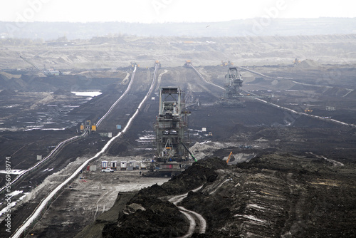 An huge excavator on a coal surface mine. Interesting geological forms of tailings dump in an open pit coal mine. 