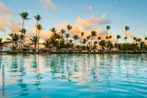 Swimming pool and palm trees in luxury resort at Pun Cana in the Dominican Republic photo