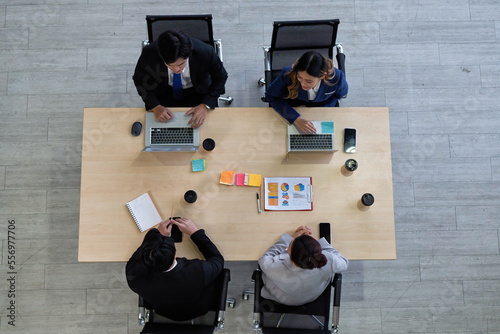 Fotografia Business meeting top view of business people in formal wear sitting at the table