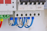  circuit breakers for protection of electrical loads installed in the electrical panel. Soft focus.