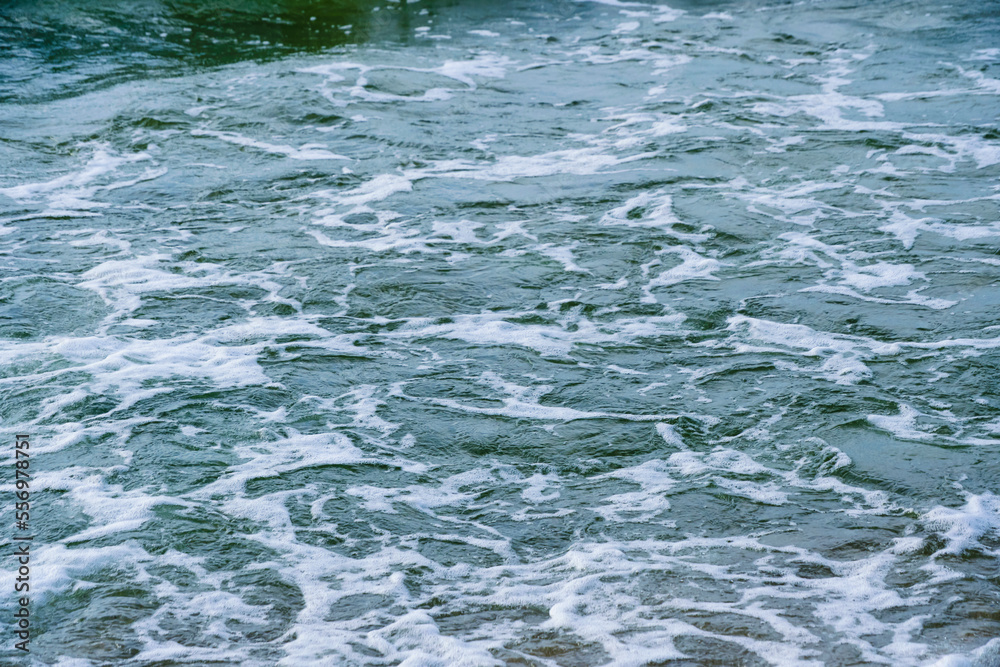 Fototapeta premium Surf wave with foam splashes on sea.