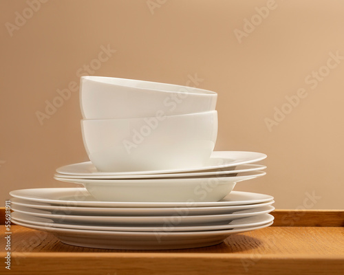 Wooden table top on defocused kitchen room and window background