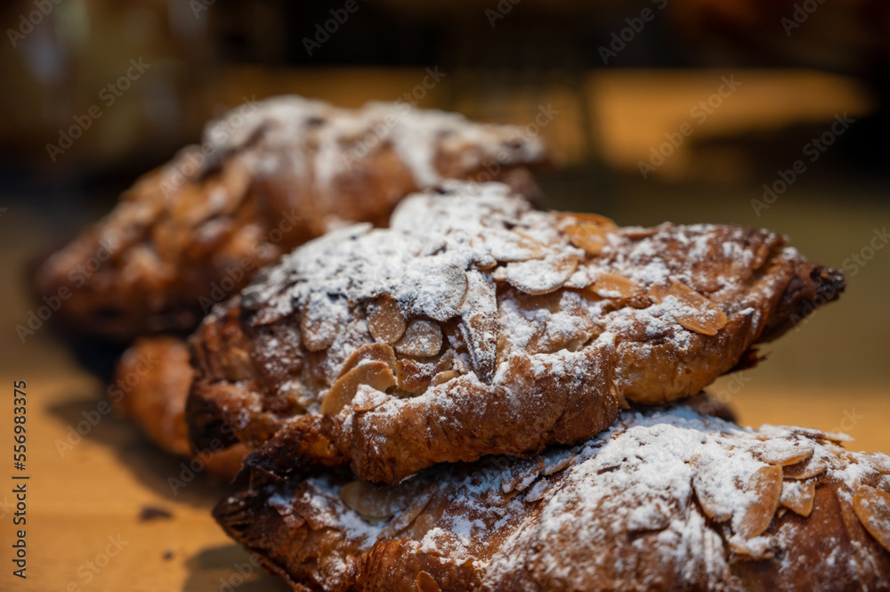 French sweet dessert pastry with almonds on display in french bakery French sweet dessert pastry with almonds on display in french bakery