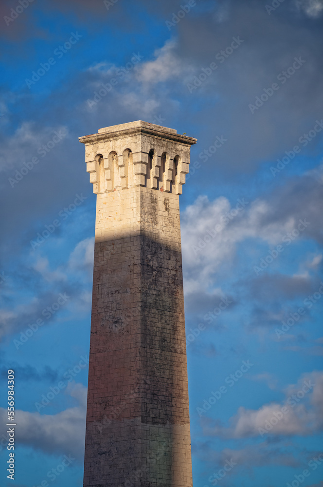 Industrial Revolution Era Factory Smoke Stack Under Blue Sky with White and Gray Clouds.