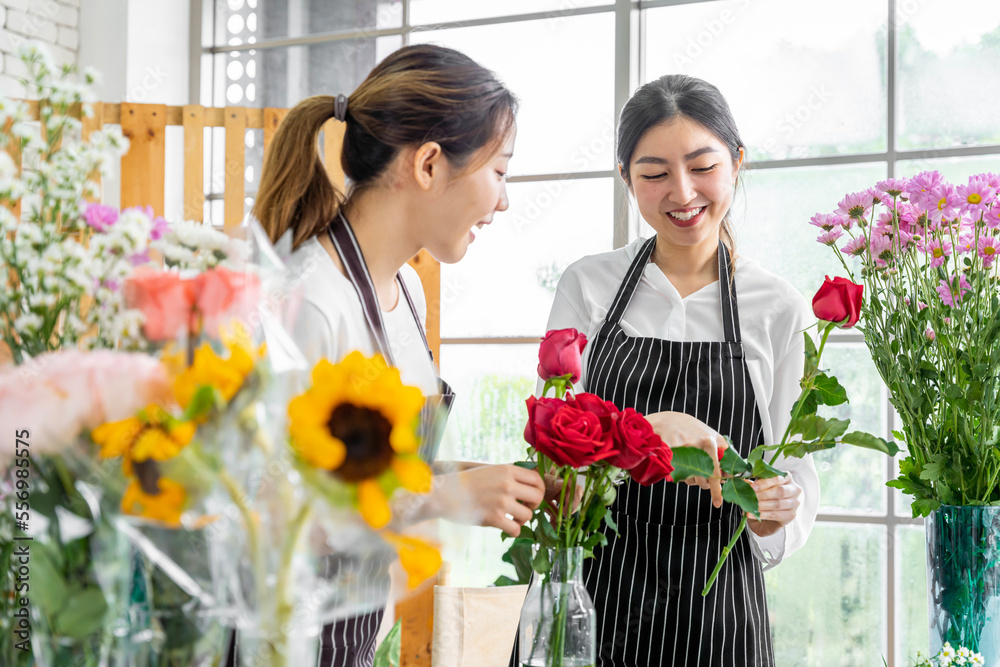 group of female florists Asians are arranging flowers for customers who come to order them for various ceremonies such as weddings, Valentine's Day or to give to loved ones. group of female florists Asians are arranging flowers for customers who come to order them for various ceremonies such as weddings, Valentine's Day or to give to loved ones.