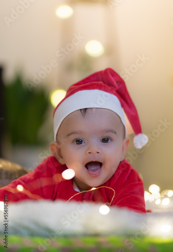 baby in santa hat smiling