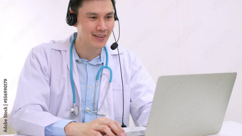 Asian woman doctor is online visiting with a patient on the internet application and Listening of the symptoms and explains how to treat the initial disease, Concept of Medical technology. Asian woman doctor is online visiting with a patient on the internet application and Listening of the symptoms and explains how to treat the initial disease, Concept of Medical technology.
