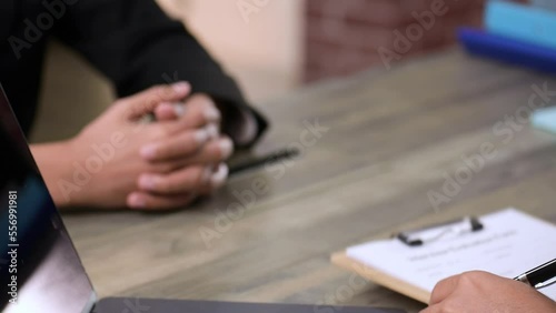 HR manager interview and listen to applicant candidate answer.He reading a resume during a job interview, employment  recruitment concept.Job application company is accepting employees from interview.