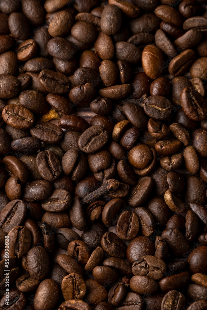 Fototapeta premium Roasted coffee beans background. Healthy beverage ingredients