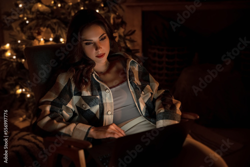 Beautiful woman relaxing on the sofa at Christmas