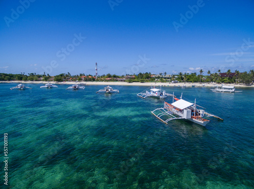 Sunny Day in Malapascua Island in Visayan Sea, One of Cebu Island. Sea water and Boats. Bounty Beach. Philippines photo