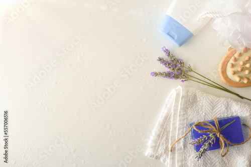 Shower products with lavender extract on white table top view photo