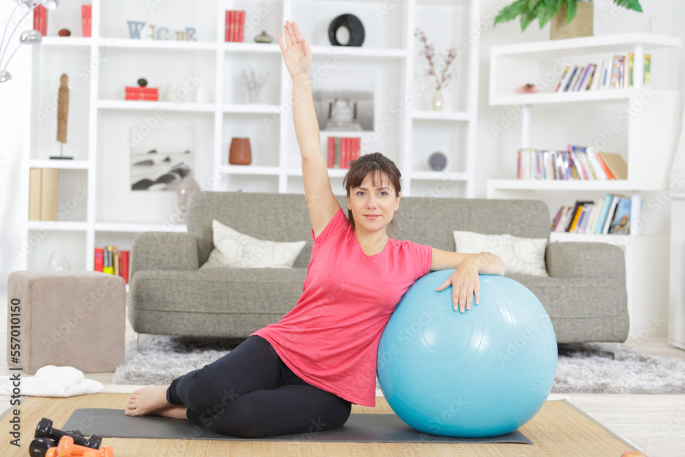 young woman exercising on aerobic ball young woman exercising on aerobic ball