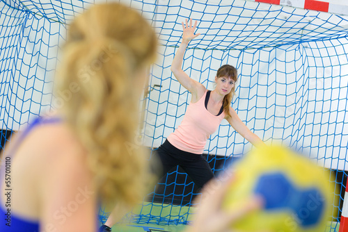 portrait of 2 women playing handball