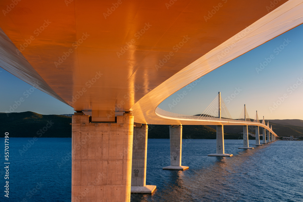 Peljesac Bridge, Croatia. Image of beautiful modern multi-span cable-stayed Peljesac Bridge over the sea in Dubrovnik-Neretva County, Croatia at sunset.