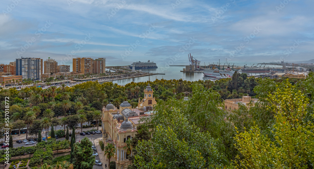Amazing panorama of Malaga city center,  seaport and marina on a beautiful sunny day with blue sky above. Scenic view of the Malaga from the Alcazaba citadel located on the hills. Andalusia, Spain.