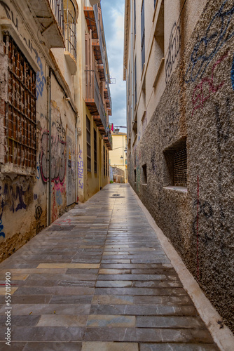 Malaga empty streets at early morning. Catedral de Malaga  Empty streets around Malaga La Manquita Cathedral in the light of the rising autumn sun. Andalusia  Spain.           