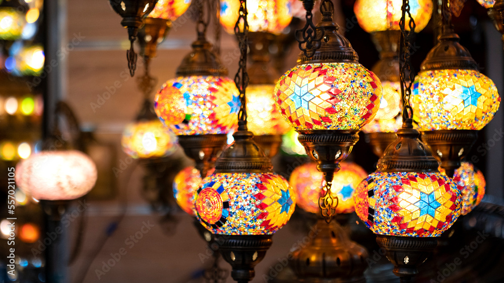 Lighting products sold in Istanbul Grand Bazaar, traditional Turkish lamps, touristic gifts, blurred background with spaces and text space	