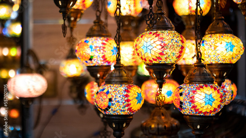 Lighting products sold in Istanbul Grand Bazaar, traditional Turkish lamps, touristic gifts, blurred background with spaces and text space 
