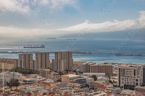 View from the Rock of Gibraltar to the bay of Gibraltar full of ships on the roadstead and The Port of Algeciras. Incredible skyline, blue sky with amazing clouds. Gibraltar, UK