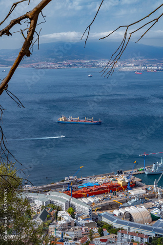 View from the Rock of Gibraltar to the bay of Gibraltar full of ships on the roadstead and The Port of Algeciras. Incredible skyline, blue sky with amazing clouds. Gibraltar, UK
