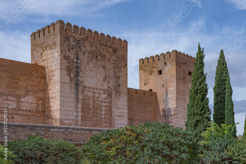 Amazing panorama of Granada city and Alhambra's Alcazaba fortress. Scenic view from Generalife gardens on a sunny day with blue sky above. Granada, Andalusia, Spain.                                   