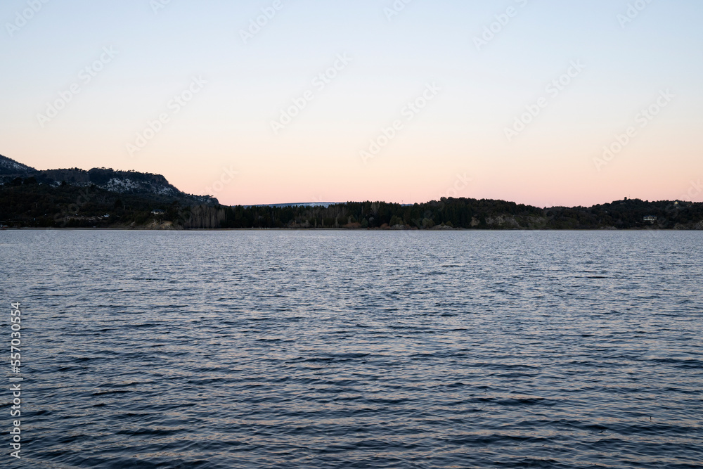 View of the lake and mountains at twilight. 