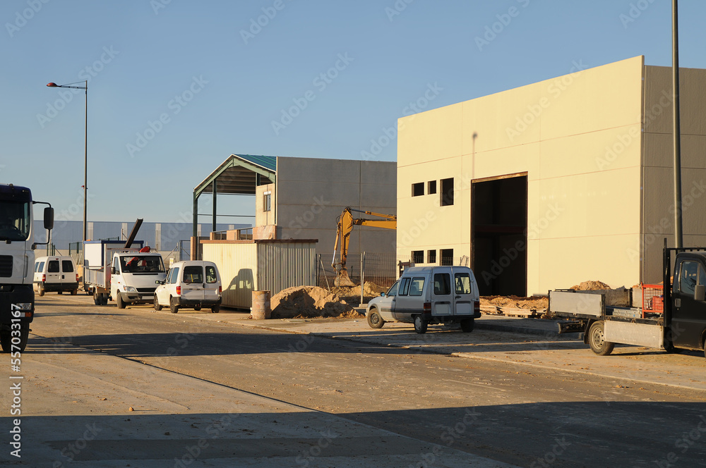 Buildings and warehouses under construction in a Spanish industrial estate.