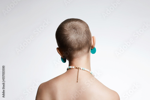 beautiful woman with short haircut. Back of naked bald Girl