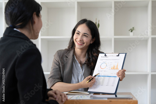 Two business leaders talk about charts, financial graphs showing results are analyzing and calculating planning strategies, business success building processes