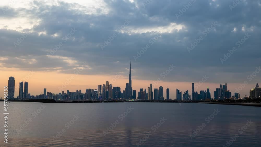 Dubai, UAE - December 21 2022: Description: Dubai city day to night timelapse. 4k time lapse of Dubai skyscrapers or skyline along with Burj khalifa captured on a cloudy day, Dubai, UAE. Dubai, UAE - December 21 2022: Description: Dubai city day to night timelapse. 4k time lapse of Dubai skyscrapers or skyline along with Burj khalifa captured on a cloudy day, Dubai, UAE.