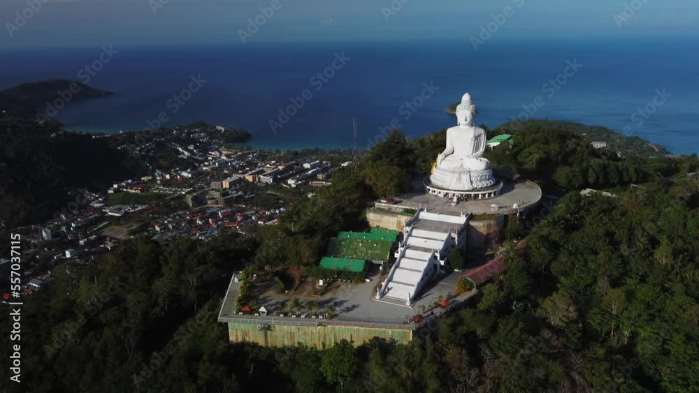 Tranquil scenery of shoreline in Thailand and huge white Buddha statue on hilltop filmed by drone. Aerial view of popular place for sightseeing and religious pilgrimage. Statue of deity in Asia Tranquil scenery of shoreline in Thailand and huge white Buddha statue on hilltop filmed by drone. Aerial view of popular place for sightseeing and religious pilgrimage. Statue of deity in Asia