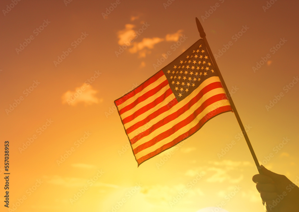 American flag against sunset background 