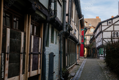 Quedlinburg  Saxony-Anhalt  Germany  28 October 2022  Schuhhof or cobbler street  Historic old vintage colored timber frame houses in medieval town  half-timbered home at sunny autumn day