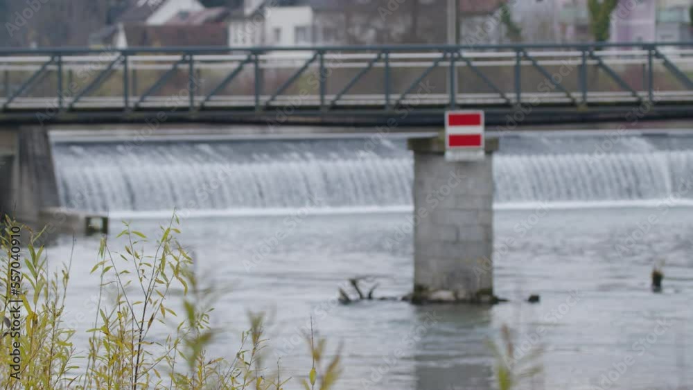 bridge over alpine river Steyr with weir bridge over alpine river Steyr with weir