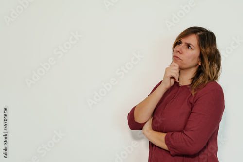 pensive woman on a white background